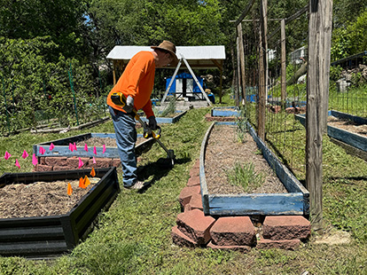 neighborhood improvement man tending grounds