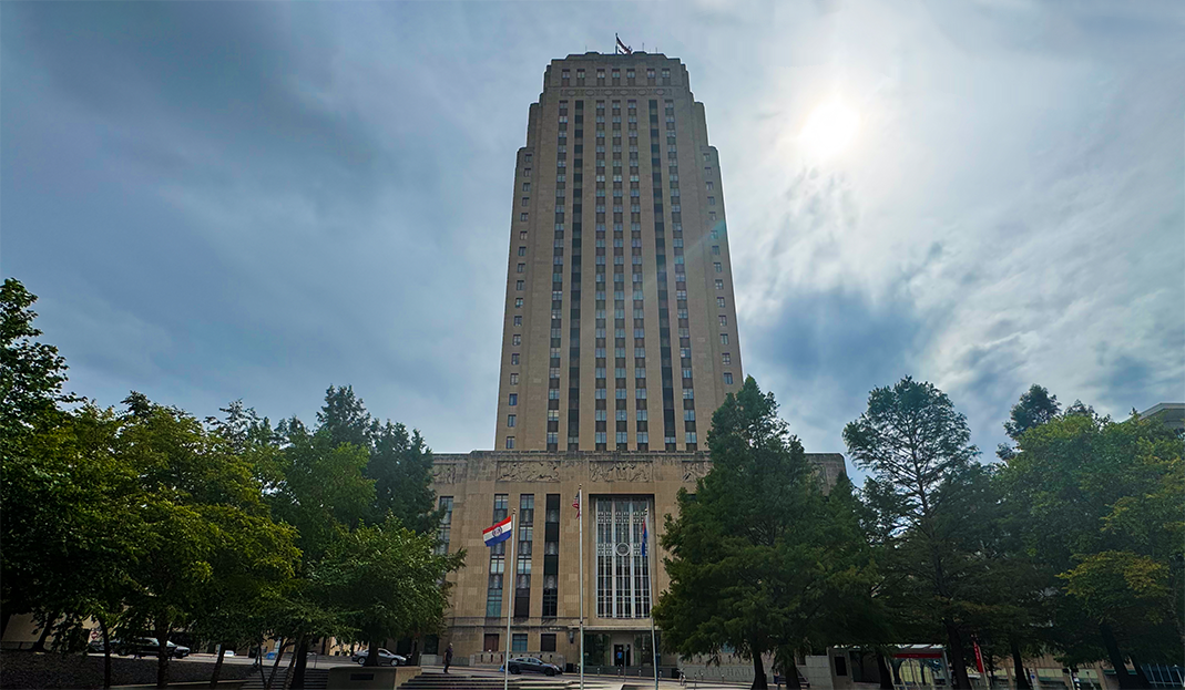 City Hall with the sun peaking through the clouds