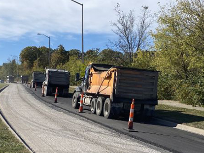 KCMO trucks resurfacing street