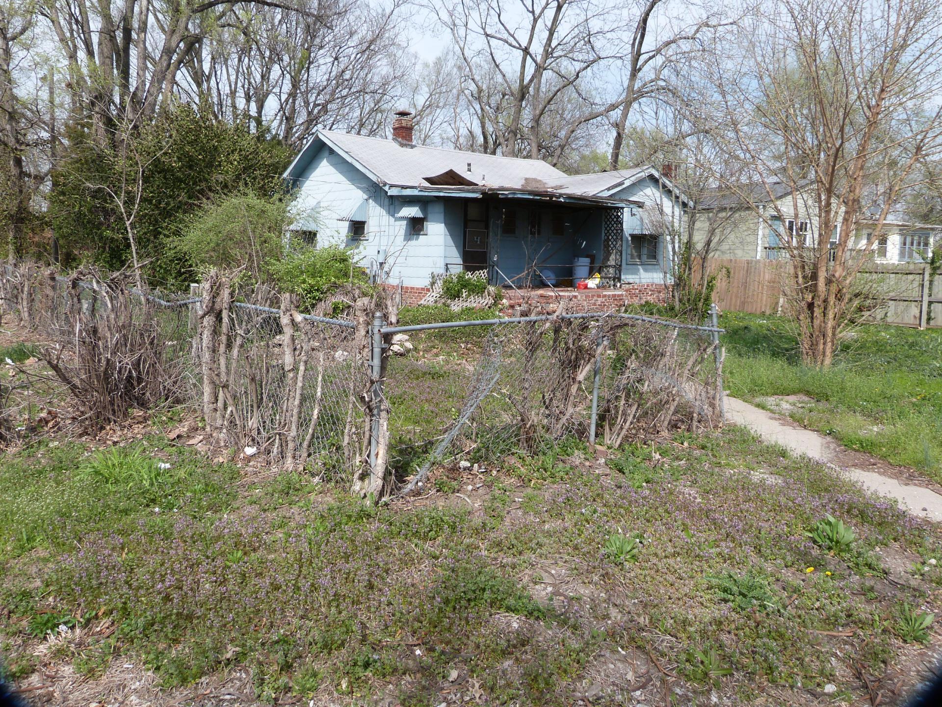 Exterior photo of back side of house located at 6301 E 35th Ter.