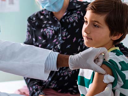 child getting immunization or vaccination