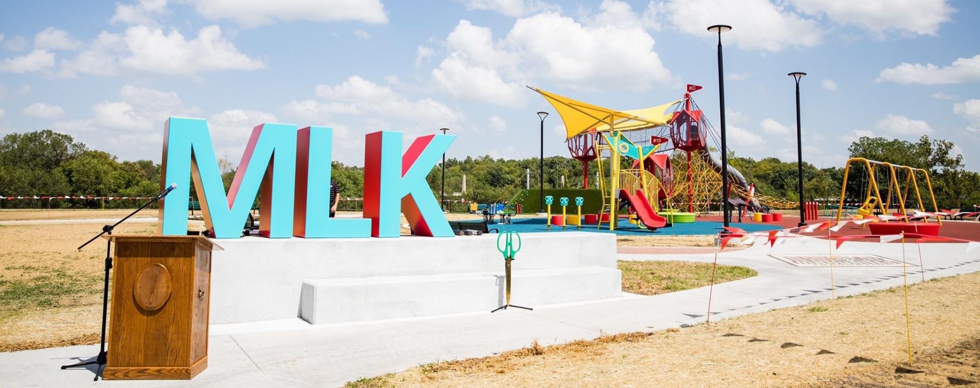 The new MLK Park playground. A podium is set up just in front in preparation for the ribbon-cutting ceremony.