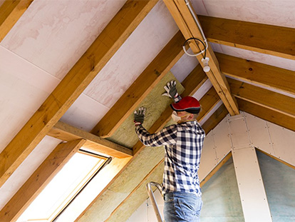 man working on ceiling