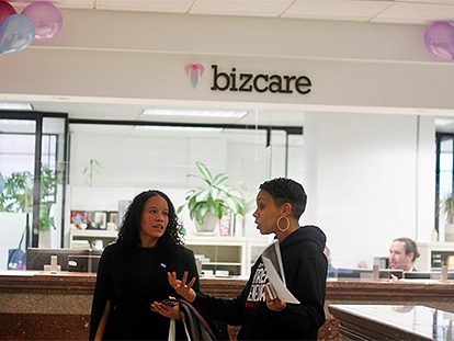 Two people at the BizCare office